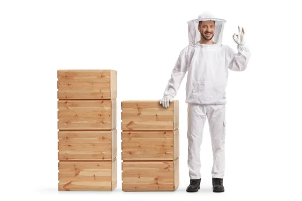 Young Male Bee Keeper Uniform Standing Next Wooden Crates Gesturing — Stock Fotó