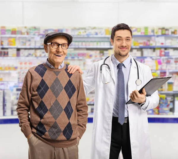 Chemist Elderly Male Patient Standing Pharmacy Looking Camera — Fotografia de Stock