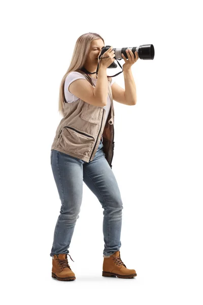Full Length Shot Female Photo Journalist Taking Photo Camera Isolated — Zdjęcie stockowe