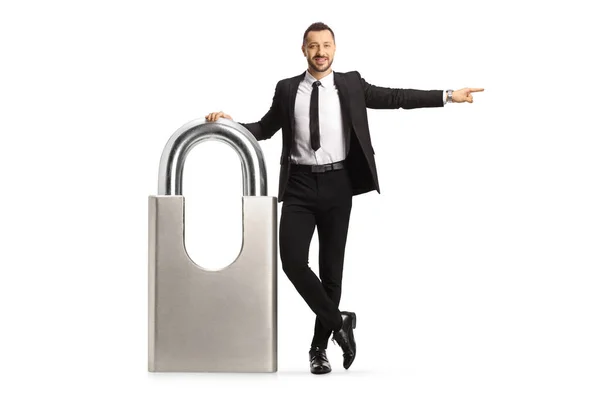 Businessman Leaning Big Padlock Pointing Isolated White Background — Fotografia de Stock