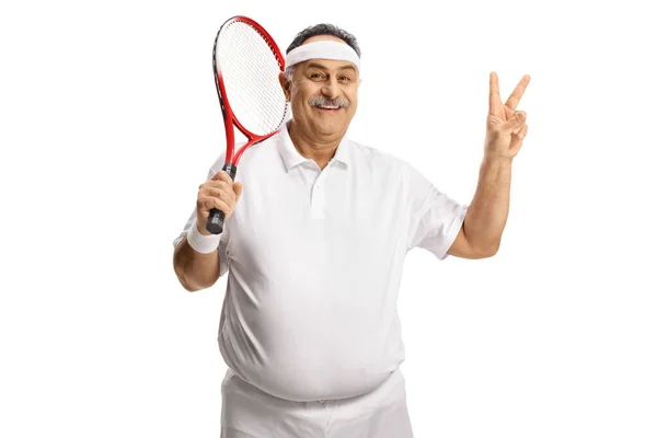 Happy Mature Man Holding Tennis Racket Gesturing Victory Sign Isolated — Fotografia de Stock