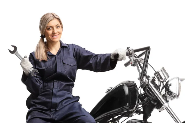 Female Mechanic Uniform Sitting Motorbike Holding Wrench Isolated White Background — Stok fotoğraf