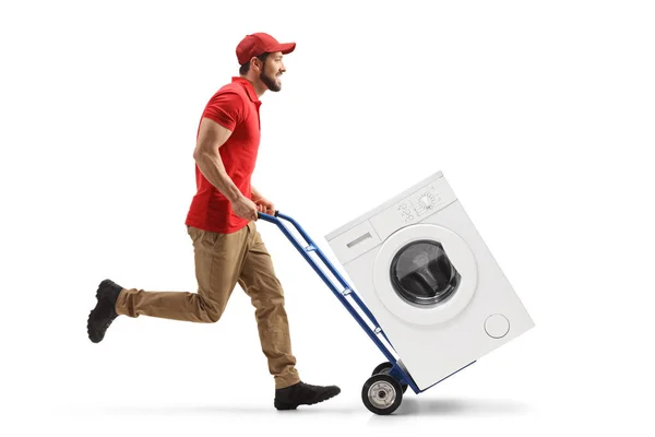 Full Length Profile Shot Male Worker Running Pushing Hand Truck — Fotografia de Stock