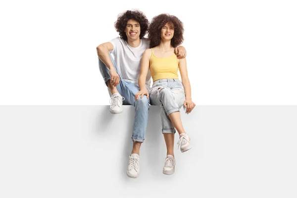 Young Man Woman Curly Hair Smiling Sitting Blank Panel Isolated — ストック写真