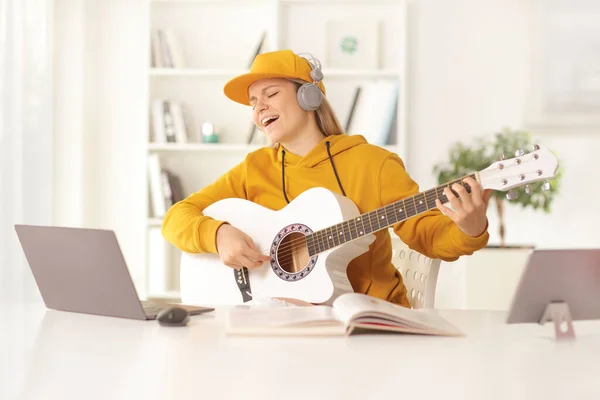 Young Female Acoustic Guitar Headphones Singing Front Laptop Computer Home — Foto Stock