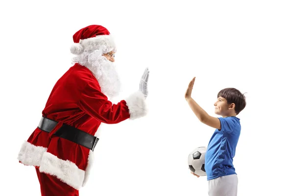 Papai Noel Gesticulando Alta Cinco Com Menino Uma Roupa Futebol — Fotografia de Stock