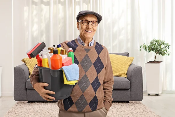 Elderly Man Holding Bucket Cleaning Supplies Standing Living Room — Stock Photo, Image