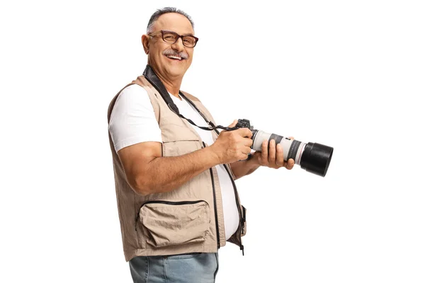 Mature Man Holding Professional Camera Looking Camera Isolated White Background — Φωτογραφία Αρχείου