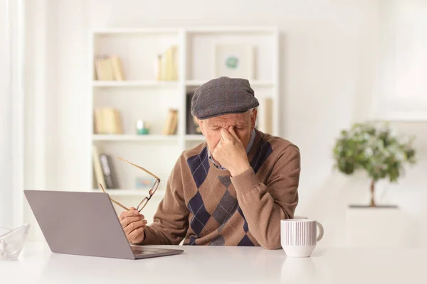 Elderly Man Having Headache Holding Document Sitting Front Laptop Computer — Stok fotoğraf