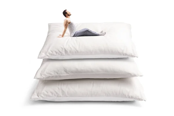 Man Pajamas Stretching Pile Pillows Isolated White Background — Stock fotografie