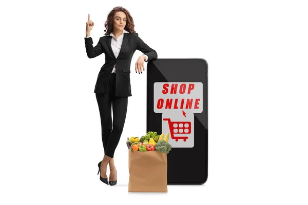 Businesswoman Leaning Smartphone Pointing Text Shop Online Grocery Bag Isolated — Foto de Stock