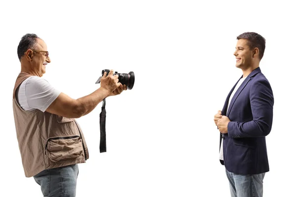 Mature Man Taking Photo Young Man Professional Camera Isolated White — Stockfoto