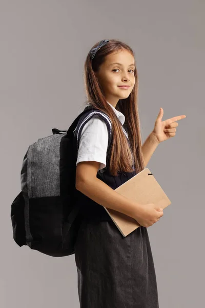 Schoolgirl Backpack Book Pointing Isolated Gray Background — 스톡 사진