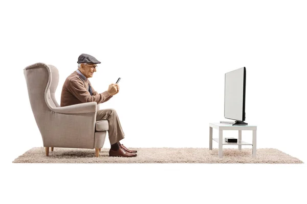 Elderly Man Armchair Sitting Front Using Smartphone Isolated White Background — стоковое фото