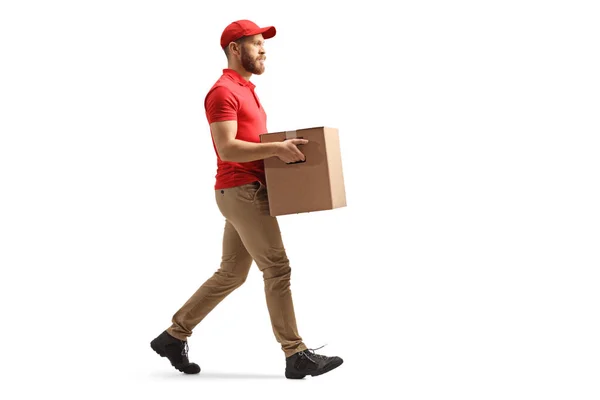 Full Length Profile Shot Courier Carrying Cardboard Box Walking Isolated — Φωτογραφία Αρχείου