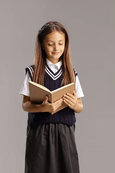 Female Pupil School Uniform Eading Book Isolated Gray Background — Fotografia de Stock