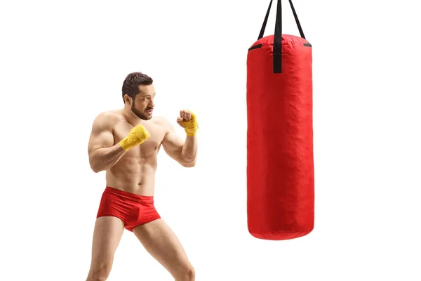 Strong Muscular Young Man Exercising Boxing Punching Bag Isolated White — Stockfoto
