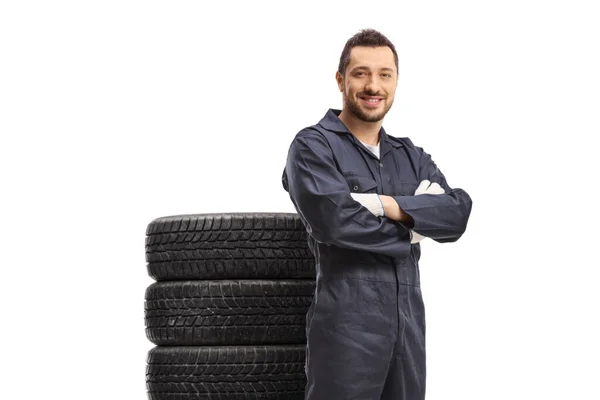 Smiling Car Mechanic Posing Pile Tires Him Isolated White Background — Photo