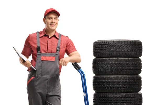 Warehouse Worker Clipboard Leaning Hand Truck Vehicle Tires Isolated White — Stock Photo, Image