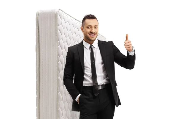 Salesman Leaning Mattress Showing Thumbs Isolated White Background — Stock Photo, Image