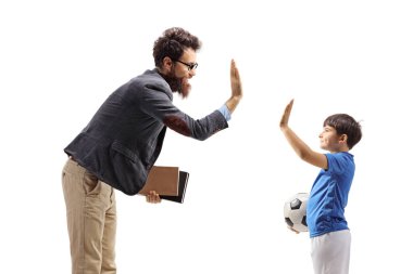 Boy in a jersey with a soccer ball gesturing high five with a teacher isolated on white background