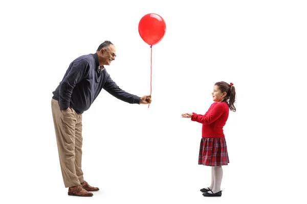 Full Length Profile Shot Mature Man Giving Red Balloon Little — Stock fotografie