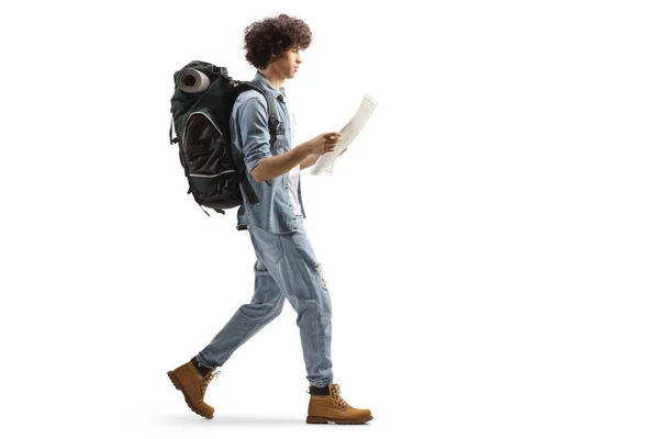 Full Length Profile Male Traveler Backpack Walking Reading Map Isolated — Stockfoto
