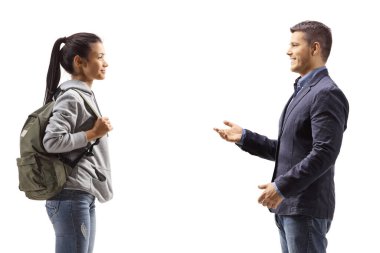 Profile shot of a female student and a young man talking isolated on white background