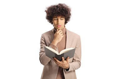 Young man with curly hair reading a book isolated on white background