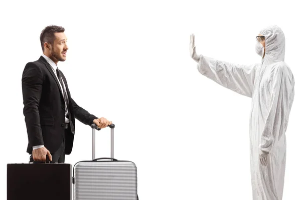 Profile Shot Man White Decontamination Suit Gesturing Stop Businessman Suitcase — Foto Stock