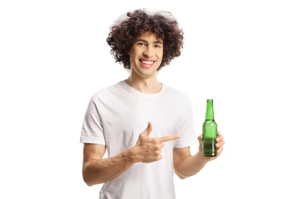 Young Man Curly Hair Holding Bottle Beer Pointing Isolated White — ストック写真