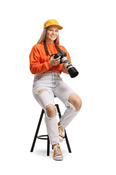 Young Trendy Woman Sitting Chair Holding Professional Camera Isolated White — Zdjęcie stockowe
