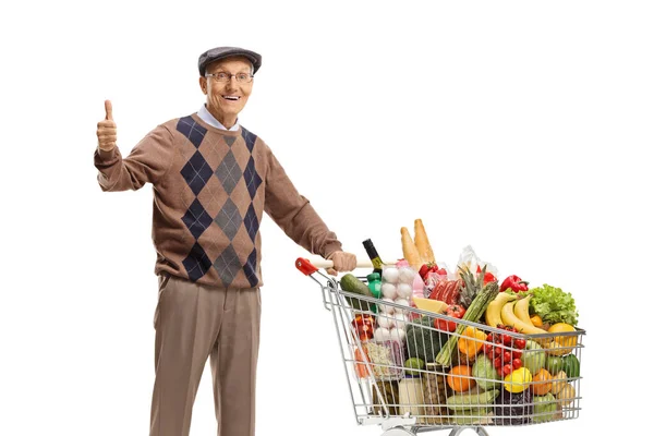 Elderly Man Standing Shopping Cart Full Food Showing Thumbs Isolated — Foto Stock