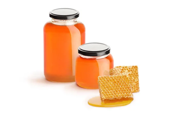Two Jars Honey Pieces Honeycomb Isolated White Background — Stok fotoğraf