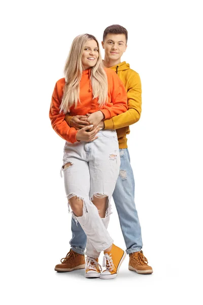 Teenage Couple Embrace Looking Camera Isolated White Background — Stockfoto