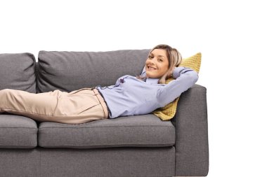 Young woman resting on a sofa isolated on white background