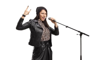 Young female singing and gesturing rock and roll sign isolated on white background
