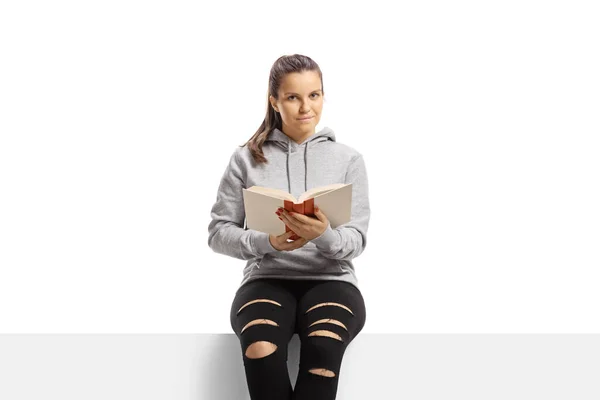 Girl Sitting Panel Holding Book Isolated White Background — 스톡 사진