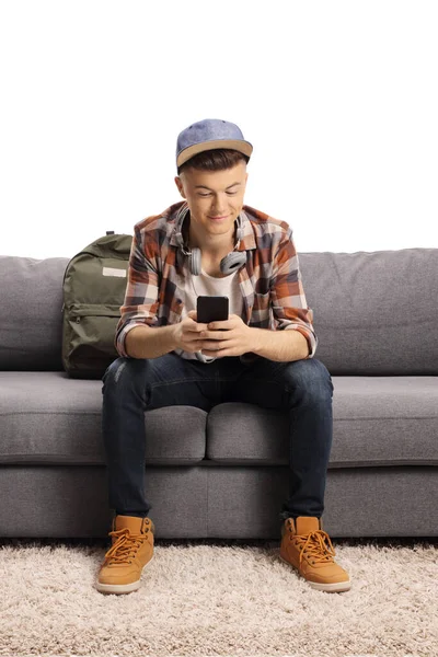 Teenager Sitting Sofa Typing Mobile Phone Isolated White Backgroun — Stock Photo, Image