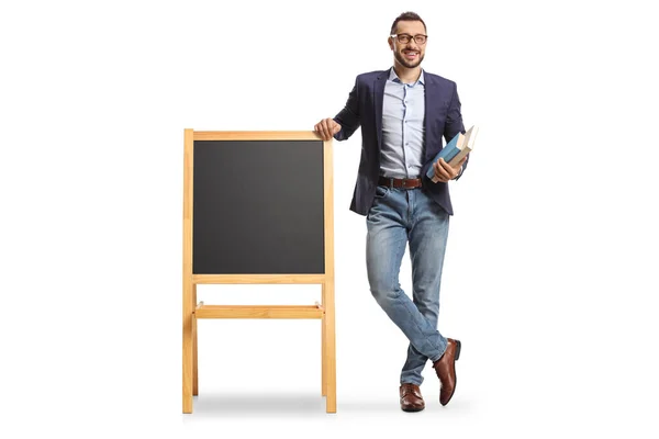 Full Length Portrait Male Teacher Holding Books Standing Next Blackboard — Zdjęcie stockowe