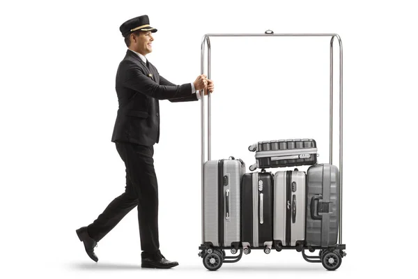 Bellboy Πιέζει Βαλίτσες Ένα Καλάθι Αποσκευών Του Ξενοδοχείου Απομονώνονται Λευκό — Φωτογραφία Αρχείου