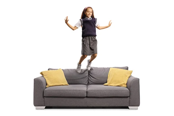 Schoolgirl Uniform Jumping Sofa Isolated White Background — Stock Photo, Image