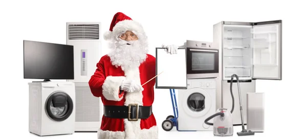 Papai Noel Apontando Para Uma Área Transferência Frente Eletrodomésticos Isolados — Fotografia de Stock