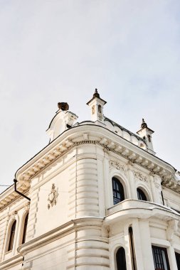 Facade of beautiful rich, white merchant's house, old manor with columns and stucco, estate of Aseev. Built in 1904. Tambov, Russia.