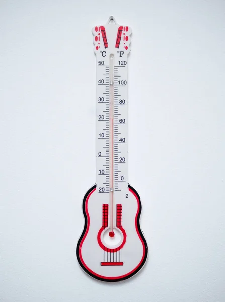 Thermometer Shape Guitar White Wall — Stock Photo, Image
