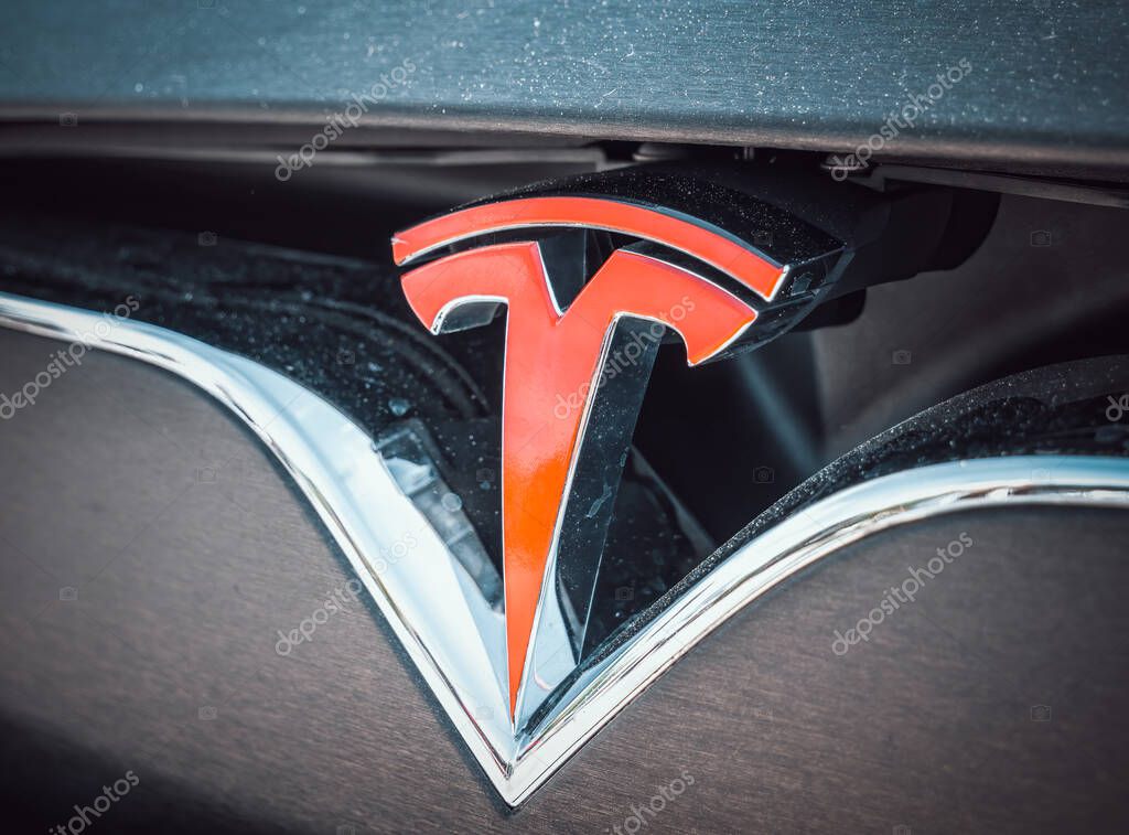 Bucharest, Romania - 05.20.2022: Close up with the logo of the famous american luxury electric car brand Tesla