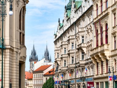Prague, Czech Republic - June 2022: Beautiful gothic architecture in the center of Prague and the towers of Church of Our Lady before Tyn in the background