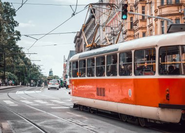 Prague, Czech Republic - June 2022: Red vintage tram public transport on the streets of Prague