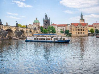 Prague, Czech Republic - June 2022: View with the Charles Bridge main touristic attraction . Medieval stone arch bridge over Vltava river in Prague