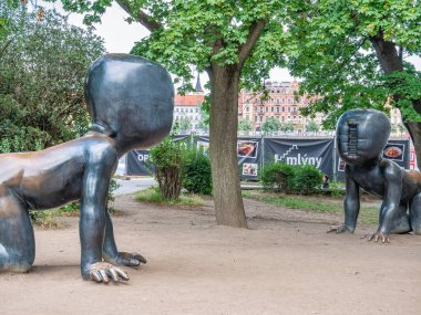 Prague, Czech Republic - June 2022: Famous sculpture Crawling Babies in Kampa Park museum, in Prague
